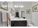 A vanity with white countertop has a mirror reflecting a walk-in shower and toilet at 4206 E Blue Ridge Pl, Chandler, AZ 85249
