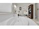 Luxurious soaking tub in a bright bathroom with modern fixtures and an open design at 4206 E Blue Ridge Pl, Chandler, AZ 85249