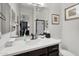 Bathroom vanity and mirror with view of the hallway and bedroom at 4206 E Blue Ridge Pl, Chandler, AZ 85249