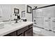 Well-lit bathroom features a shower over tub and dark vanity with white countertop at 4206 E Blue Ridge Pl, Chandler, AZ 85249