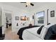 Stylish bedroom with ceiling fan and ample natural light from a large window at 4206 E Blue Ridge Pl, Chandler, AZ 85249