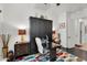 A versatile bedroom featuring a Murphy bed, desk, neutral decor, and a colorful rug at 4206 E Blue Ridge Pl, Chandler, AZ 85249