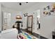 A stylish bedroom includes a closet, television, dark wood floors, and bright decor at 4206 E Blue Ridge Pl, Chandler, AZ 85249