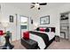 Bedroom featuring a decorative ceiling fan and ample natural light from a large window at 4206 E Blue Ridge Pl, Chandler, AZ 85249