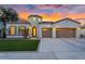 Stunning single-story home with a well-manicured lawn, desert landscaping, and a three-car garage at 4206 E Blue Ridge Pl, Chandler, AZ 85249