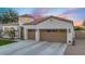 Beautiful home with a well-manicured lawn, three-car garage, and covered entryway at 4206 E Blue Ridge Pl, Chandler, AZ 85249
