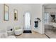 Elegant foyer with decorative mirror, arched doorway, and stylish seating area at 4206 E Blue Ridge Pl, Chandler, AZ 85249