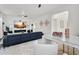 Open-concept living room featuring sleek furnishings, modern decor, and an adjacent bar area at 4206 E Blue Ridge Pl, Chandler, AZ 85249