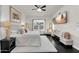 Beautiful main bedroom with dark hardwood floors, a flat screen television and comfortable furniture at 4206 E Blue Ridge Pl, Chandler, AZ 85249