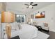 Cozy main bedroom featuring large windows and a flat screen television at 4206 E Blue Ridge Pl, Chandler, AZ 85249