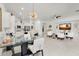 A stunning open-concept floorplan with a kitchen, dining area, and living room featuring white walls and modern decor at 4206 E Blue Ridge Pl, Chandler, AZ 85249