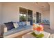 Cozy outdoor patio with comfortable seating, sliding glass doors, and tasteful decor perfect for relaxing or entertaining at 4206 E Blue Ridge Pl, Chandler, AZ 85249