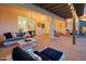 Spacious covered patio with stylish furnishings, offering a perfect setting for outdoor relaxation and entertaining at 4206 E Blue Ridge Pl, Chandler, AZ 85249