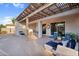 Inviting covered patio features a relaxing lounge area with comfortable seating and easy access to the outdoors at 4206 E Blue Ridge Pl, Chandler, AZ 85249