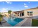Inviting backyard pool with covered patio and outdoor seating, perfect for relaxation and entertaining at 4206 E Blue Ridge Pl, Chandler, AZ 85249