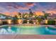 Backyard pool with waterfall feature, lush landscaping, and patio area at 4206 E Blue Ridge Pl, Chandler, AZ 85249