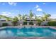 Stunning pool with cascading waterfalls and lush landscaping, creating a private and serene backyard retreat at 4206 E Blue Ridge Pl, Chandler, AZ 85249