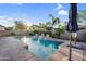 Private backyard pool with cascading waterfalls and well-manicured landscaping, ideal for summer enjoyment at 4206 E Blue Ridge Pl, Chandler, AZ 85249