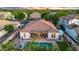 Aerial view of a private backyard with a pool, covered patio, palm trees, and elegant outdoor furniture at 4206 E Blue Ridge Pl, Chandler, AZ 85249