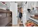 Organized walk-in closet with custom shelving, drawers, and hanging space for clothes and accessories at 4206 E Blue Ridge Pl, Chandler, AZ 85249