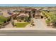 An attractive home with manicured front lawn and landscaping in a peaceful desert community at 4418 W Yoosooni Dr, New River, AZ 85087