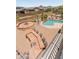 Entertainer's backyard with a pool, outdoor bar with seating, a fire pit and desert landscaping at 4418 W Yoosooni Dr, New River, AZ 85087