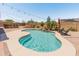 Sparkling pool with a waterfall feature, lounge chairs, desert landscaping and backyard bar at 4418 W Yoosooni Dr, New River, AZ 85087