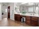 Bathroom with dual sink vanity, large mirror, and step in shower at 4418 W Yoosooni Dr, New River, AZ 85087