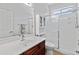 A bright bathroom featuring a glass-enclosed shower and wooden vanity at 4418 W Yoosooni Dr, New River, AZ 85087