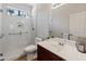 Contemporary bathroom featuring glass shower and sleek vanity with white countertops at 4418 W Yoosooni Dr, New River, AZ 85087