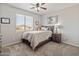 Bedroom featuring a comfortable bed, a window, and a neutral color palette at 4418 W Yoosooni Dr, New River, AZ 85087