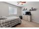 A cozy bedroom with a neutral color scheme and a large window at 4418 W Yoosooni Dr, New River, AZ 85087