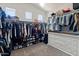 Spacious walk-in closet with ample storage and clothing racks at 4418 W Yoosooni Dr, New River, AZ 85087