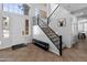 Bright entryway with staircase features tile flooring, and a chandelier over the front door at 4418 W Yoosooni Dr, New River, AZ 85087