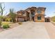 Spacious two-story home with desert landscaping, and a three car garage at 4418 W Yoosooni Dr, New River, AZ 85087