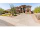 Beautiful two-story home featuring lush xeriscape, a large driveway, and an inviting front entrance at 4418 W Yoosooni Dr, New River, AZ 85087