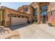 Well maintained two story home with large garage and an American flag out front at 4418 W Yoosooni Dr, New River, AZ 85087