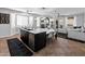 Bright kitchen with a central island, a view of the backyard, and a cozy living space nearby at 4418 W Yoosooni Dr, New River, AZ 85087