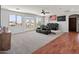 Spacious living room with movie chairs, ceiling fan, and backyard views at 4418 W Yoosooni Dr, New River, AZ 85087