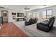 Bright living room with movie chairs, ceiling fan, and exterior views at 4418 W Yoosooni Dr, New River, AZ 85087