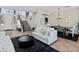 Open-concept living space with view of staircase and dining area is awash in natural light at 4418 W Yoosooni Dr, New River, AZ 85087