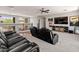 Open loft area with tiered seating, ceiling fan, and balcony access at 4418 W Yoosooni Dr, New River, AZ 85087