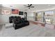 Upstairs loft area with tiered seating, ceiling fan, and large windows at 4418 W Yoosooni Dr, New River, AZ 85087