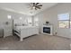 A beautiful main bedroom with a cozy fireplace and ample natural light at 4418 W Yoosooni Dr, New River, AZ 85087