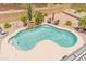 Inviting backyard pool with waterfall feature, lounge chairs, desert landscaping and lush greenery at 4418 W Yoosooni Dr, New River, AZ 85087