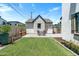 Cozy backyard features green grass, outdoor seating, and additional structure at 4901 E Amelia Ave, Phoenix, AZ 85018