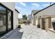 Backyard featuring brick pavers, built-in BBQ and outdoor kitchen and detached garage at 4901 E Amelia Ave, Phoenix, AZ 85018
