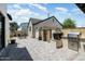 Backyard featuring brick pavers, built-in BBQ and outdoor kitchen and detached garage at 4901 E Amelia Ave, Phoenix, AZ 85018
