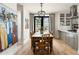 Inviting dining area with a rustic table, pendant lighting, and a view to the backyard at 4901 E Amelia Ave, Phoenix, AZ 85018