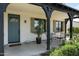 Cozy front porch with seating, decorative accents, and a charming entryway at 4901 E Amelia Ave, Phoenix, AZ 85018